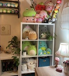 a shelf filled with lots of stuffed animals