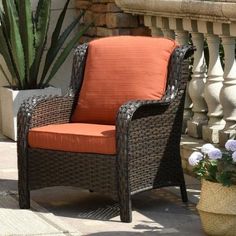 an orange chair sitting on top of a patio