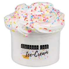 an ice cream container with sprinkles and white frosting on it's top