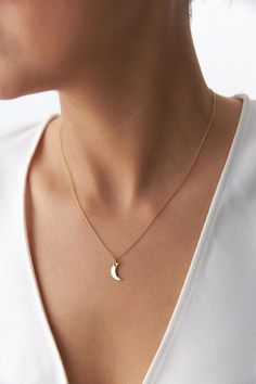 Our new delicate crescent moon pendant/necklace crafted with gleaming 14k gold. The perfect fine necklace for a minimal elegant touch. ★ Pendant/Necklace Features (The model in the pictures is wearing a 14k yellow gold necklace)(This design can be made as a pendant or as a necklace according to your preference)• Gold Karat: 14K/18K Solid Gold (All pieces are stamped for authenticity)• Gold Colors Available: Yellow Gold, White Gold, Rose Gold• Pendant Dimensions: 12.3 mm by 7.7 mm / 0.48 Inch by Gold Crescent Moon Necklace, Fine Necklace, Gold Crescent Moon, 16 Inch Necklace, 14k Yellow Gold Necklace, Crescent Moon Pendant, Moon Pendant Necklace, Yellow Gold Necklace, Gold Colors