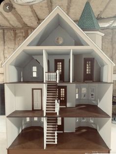 a model house with stairs leading up to the second floor