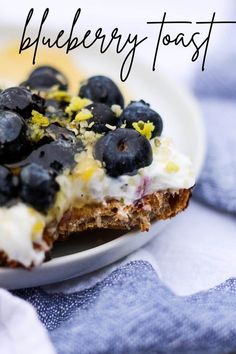 blueberry toast on a white plate with lemons