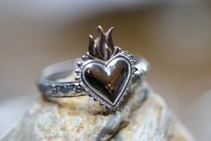 "I created this beautiful ring from a solid sterling silver floral patterned band, 3.4mm wide.  Upon it I soldered a gorgeous 10x13mm (1/2\" tall) flaming heart, made from sterling silver and bronze.  You may choose the shiny polished version or the darkened/antiqued and polished style.  Both are pictured. Any Size. Gift boxed with bow." Flaming Heart, Mood Stone, Polished Style, Plastic Ring, Ring Stand, Beautiful Ring, Sacred Heart, Ring Sterling Silver, Stackable Rings