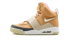 Rounding out the Nike Air Yeezy trio, the “Net” iteration of the sneaker was the last to release on June 1, 2009.   Like the previous two colorways, the subtle changes to the upper define these kicks.  Anchored by a buttery tan leather upper, this version does away with the all-over "Y" print on the strap and heel.  Instead, the former sports a patent leather look in beige, while the latter portion appears in a supple leather.  The aforementioned "Y" print makes an appearance on the mudguard – a Yeezy 1, Air Yeezy, Tan Shoes, Perforated Leather, Leather Shoes Woman, Kanye West, Sneaker Head, Air Jordan Sneaker, Leather Shoes