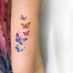 colorful butterflies tattoo on the arm