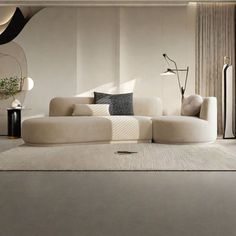 a modern living room with white couches and rugs