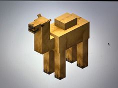 an animal made out of wood sitting on top of a table