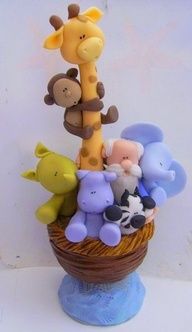 a giraffe and other stuffed animals in a basket