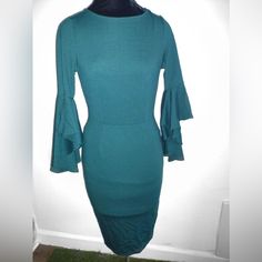 Nwt Vfshow Bell Ruffle Sleeve Bodycon Sheath Midi Pencil Dress Dark Green Blue Size Xs This Lovely, Slimming, Feminine, And Elegant Dress Is Professional And Understated. The Fabric Is Slightly Stretchy. Beautiful High-Low Bell Sleeves. Round Scoop Neckline And Form Fitting. Sexy, Yet Modest. Midi Knee Length. Concealed Back Zipper Closure. Great Condition. Occasion: Wedding, Engagement, Bridal Shower, Bachelorette Party, Semi-Formal, Church, Or Graduation. Fitted Knee-length Ruffled Bodycon Dress, Fitted Knee-length Bodycon Dress With Ruffles, Fitted Ruffle Sleeve Mini Dress For Date Night, Green Ruffle Bodycon Dress, Stretch Midi-length Bodycon Dress With Ruffles, Green Fitted Mini Dress With Ruffle Sleeves, Fitted Dress With Ruffle Sleeves For Date Night, Fitted Sheath Midi Dress For Brunch, Ruffle Sleeve Fitted Mini Dress For Formal Events