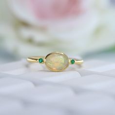 Elegant Fire Opal Promise Ring 14k Yellow Gold Bridesmaid Jewelry Alternative Emerald Stacking Ring Bithday Gift For Her Unique Promise Ring Maine Stone -Opal  Stone Creation - Lab Created  Stone Shape - Round Stone Color - Fire Opal Stone Size - 5 MM Secondary Stone - Emerald ( Lab Created ) Stone Shape - Round Stone Color - Green Features: * Handmade * Ready To Ship * Center Stone Pearl * Brand New * All Ring Sizes Available * Suitable For Every Day * 14k Solid Gold / 18k Solid Gold / Gold Fil Opal Ring With Gemstone Accents For Gift, Green Opal Ring With Accent Stones For Gift, Handmade Elegant Green Opal Ring, Gold Opal Gemstone Ring Gift, 14k Gold Opal Ring With Gemstone Accents As Gift, Gold Bridesmaid Jewelry, Opal Promise Ring, Opal Stacking Ring, Gemstone Stacking Ring