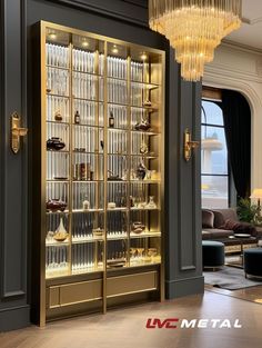 an elegant display case in the middle of a living room with chandelier above it