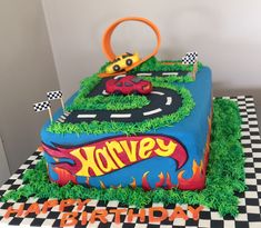 a birthday cake made to look like a race track