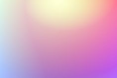 a blurry image of an orange and pink background