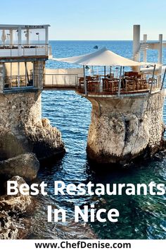 an advertisement for the best restaurants in nice france, featuring two stone pillars with tables and umbrellas on them