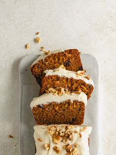 three slices of carrot cake with cream cheese frosting