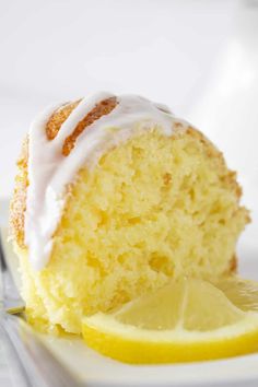 a slice of lemon bundt cake on a plate with a fork