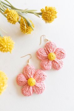 The Annie Floral Raffia Earrings are a stunning addition to any jewelry collection. Handmade with high-quality woven raffia, these earrings feature a beautiful floral design in vibrant spring and summer colors. Perfect for adding a pop of color to any outfit, these earrings are a must-have accessory for any fashion-forward individual. Lightweight and comfortable to wear, these earrings are designed for all-day wear. The intricate woven design showcases the craftsmanship that goes into each pair, Spring Gift Jewelry In Natural Color, Natural Color Spring Jewelry Gift, Spring Natural Color Jewelry Gift, Natural Jewelry Gift For Spring, Spring Woven Earrings, Summer Handwoven Pink Jewelry, Handwoven Pink Jewelry For Summer, Handmade Pink Flower Earrings For Beach, Handwoven Pink Drop Earrings