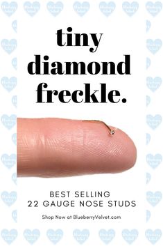 a finger with the words tiny diamond freckle on it