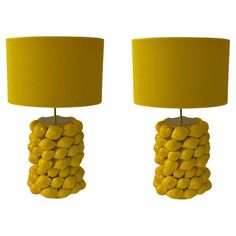 two lamps made out of corn on the cob and yellow shade are next to each other