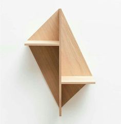 a wooden shelf with two shelves on each side and an angled section at the top