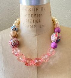 Feminine shades of pink with handmade decoupage beads covered in vintage prints Pink Round Beads Necklace For Spring, Spring Pink Jewelry With Colorful Beads, Pink Necklaces With Colorful Beads For Spring, Vintage Hand Painted Pink Jewelry, Spring Pink Beaded Necklace, Vintage Pink Beaded Necklace As A Gift, Handmade Pink Beaded Necklace For Summer, Spring Pink Round Bead Necklaces, Hand Painted Pink Jewelry For Party