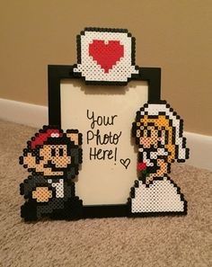 a pixelated photo frame with an image of a bride and groom holding a heart