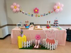 the table is set up for a peppa pig birthday party