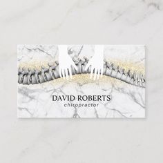 a business card with an image of toothbrushes and gold glitters on it