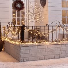 a house with christmas lights on the front porch