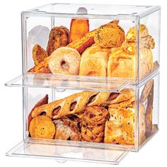 two clear boxes filled with different types of breads and pastries in each container