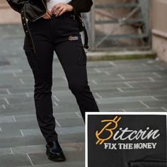 Our exclusive Bitcoin Cargo Pants in Black for women are more than just Bitcoin clothing; it is an expression of your lifestyle. These trousers were designed for sophisticated women looking for style and functionality. Made from 97% organic cotton, it not only offers the highest level of comfort, but also natural elasticity for unrestricted freedom of movement. The twill fabric gives the pants a washed look that is contemporary and versatile. The practical details such as the numerous pockets, including a hidden pocket with an invisible zipper, offer enough storage space for your essentials. The buttons and zipper are made from recycled material, and the pants feature reinforcements such as ribbed seams at the front and back. These cargo pants are characterized by the masterfully embroider Cargo Pants For Women, Sophisticated Women, Hidden Pocket, Cargo Pants Women, Cargo Trousers, Freedom Of Movement, Twill Fabric, Invisible Zipper, Trousers Women