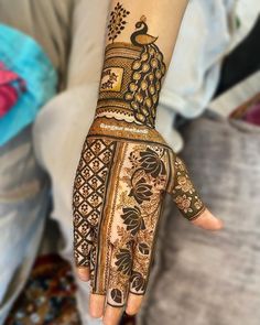 a woman's hand is decorated with hennap and designs on her hands