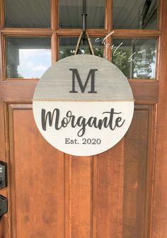 a wooden door with a sign that says morganite