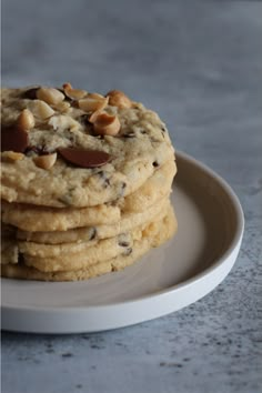 a stack of cookies sitting on top of a white plate