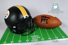 a football, helmet and ball on a green mat for a birthday or anniversary cake