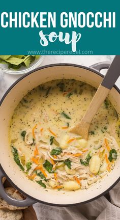 chicken gnocchi soup in a pot with a wooden spoon and bread on the side