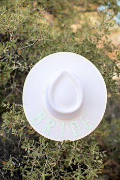 Calling all bride-to-be's, you NEED this hat! Our "Bride" Wool Panama is a GB original and the ultimate hat to change up your wedding looks. Can you even imagine how next level this hat will be at bridal showers, bachelorette parties, chic wedding days, we CAN NOT WAIT! This hat comes in 2 premium styles, the Rancher (structured pointed crown) and Gambler (structured round crown). With impeccable quality, it's 100% felted wool with a flat stiff brim. Don't pass up on this one babes, we are manif Customizable White Wedding Hats, Bachelorette Parties, Felted Wool, Wedding Looks, Bridal Showers, Chic Wedding, Bachelorette Party, Wool Felt, Panama