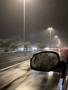 the rain is falling on the windshield of a car