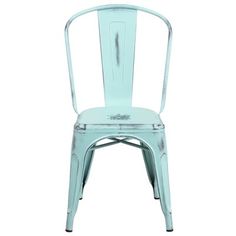 an aqua colored metal chair with the back turned to look like it has been painted