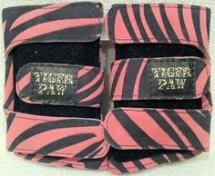 two pink and black zebra print wrist wraps