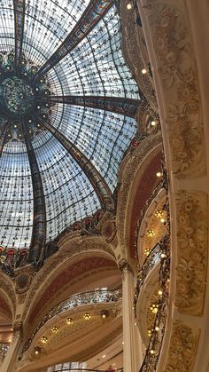 an ornate glass ceiling in a building