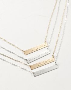 "This bar necklace is a classic, easy to gift piece. From the chain to the pendant, this style is made with 14k gold filled or sterling silver pieces, meaning it is built to last. Personalize this necklace with the names, dates, and special words that mean the most to you! 𝗘𝗮𝘀𝘆 𝗧𝗼 𝗦𝘁𝘆𝗹𝗲, 𝗠𝗮𝗱𝗲 𝗧𝗼 𝗟𝗮𝘀𝘁 Our classic bar necklaces make for the perfect everyday piece, personalized with your most special sentiments, moments, and memories! Created to last a lifetime, these necklaces Silver Bar Necklace Perfect As A Gift, Minimalist Sterling Silver Bar Necklace For Anniversary, Personalized Silver Bar Necklace With Rectangular Pendant, Gold Engraved Bar Necklace For Mother's Day, Elegant Silver Bar Necklace With Custom Name, Engraved Gold Bar Necklace For Mother's Day, Personalized Silver Bar Necklace, Mother's Day Engraved Gold Bar Necklace, Gold Nameplate Bar Necklace As Gift