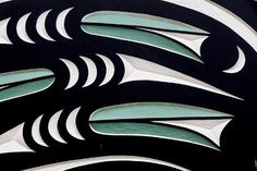 an art deco design on the side of a building with green and white stripes around it