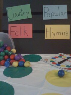 a table topped with lots of colorful balls