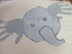 an elephant is drawn on a piece of paper with blue ink and it's shadow