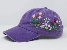 Flower is 100% hand embroidered on a 100% cotton wash baseball cap. Hat is one size fits all with adjustable back strap. Unique cap, one of a kind! I am also open for customization. If you want the item in different colors, please message me, it will take additional 2-3 days of handling time. Free first class shipping, upgradable priority mail service. 30 days return policy, feel confident at your purchase! Adjustable Hat With Custom Embroidery For Spring, Embroidered Baseball Cap With Curved Bill For Spring, Spring Snapback Hat With Embroidered Logo And Curved Bill, Embroidered Adjustable Snapback Hat For Spring, Adjustable Hats With Floral Embroidery And Curved Bill, Spring Adjustable Snapback Hat With Embroidered Logo, Purple Cotton Hat For Spring, Spring Snapback Hat With Custom Embroidery, Purple Baseball Cap For Spring