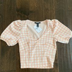 Adorable Pink Gingham Top With Puff Sleeves. Nwt. The Top Is A Size S, But Definitely Fits More Like A Xs. Top Is Cropped Length, But As You Can See In Pics If Work With High Waisted Bottoms It Doesn’t Look As Cropped. Spring Plaid Puff Sleeve Top, Plaid Puff Sleeve Top For Spring, Trendy Fitted Gingham Top, Fitted Gingham Top Trendy Style, Fitted Gingham V-neck Top, Casual Fitted Gingham Tops, Gingham V-neck Tops For Spring, Spring Gingham V-neck Top, Fitted Gingham Tops For Day Out