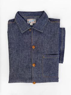 The Watertown Shirt comes unwashed and is cut so that the measurements match the labeling AFTER an initial cold soak/line dry. We recommend this straight-forward easy protocol before wearing: Rinse in cold water, machine setting on delicate, full cycle. Line dry, no heat dryer. Made of premium indigo selvedge chambray, 6.5 oz. slubby, 85% cotton, 15% linen tightly woven blend. It has a plain weave dark indigo warp with unbleached weft yarns, dry-hand, and a white/red stripe selvedge ID. ✦ Features: An original mfsc shirt pattern, inspired by French 1950s vintage casual shirts, blending sportswear and workwear vibes. Short sleeves, period cut. Straight shirttail tuck-out style, side slits. French style “col requin” (shark fin collar), with 1950s-style collar loop. Contrast Californian-style Water Machine, Shark Fin, Chambray Fabric, Book Clothes, 1950s Style, Vintage Inspired Outfits, Ripstop Fabric, Dark Indigo, Hair Fragrance