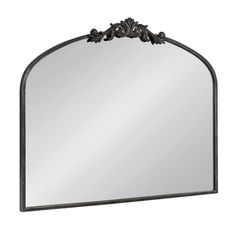 an ornate metal frame mirror on a white background