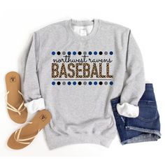 a gray sweatshirt with the words baseball on it next to some sandals and a pair of jeans